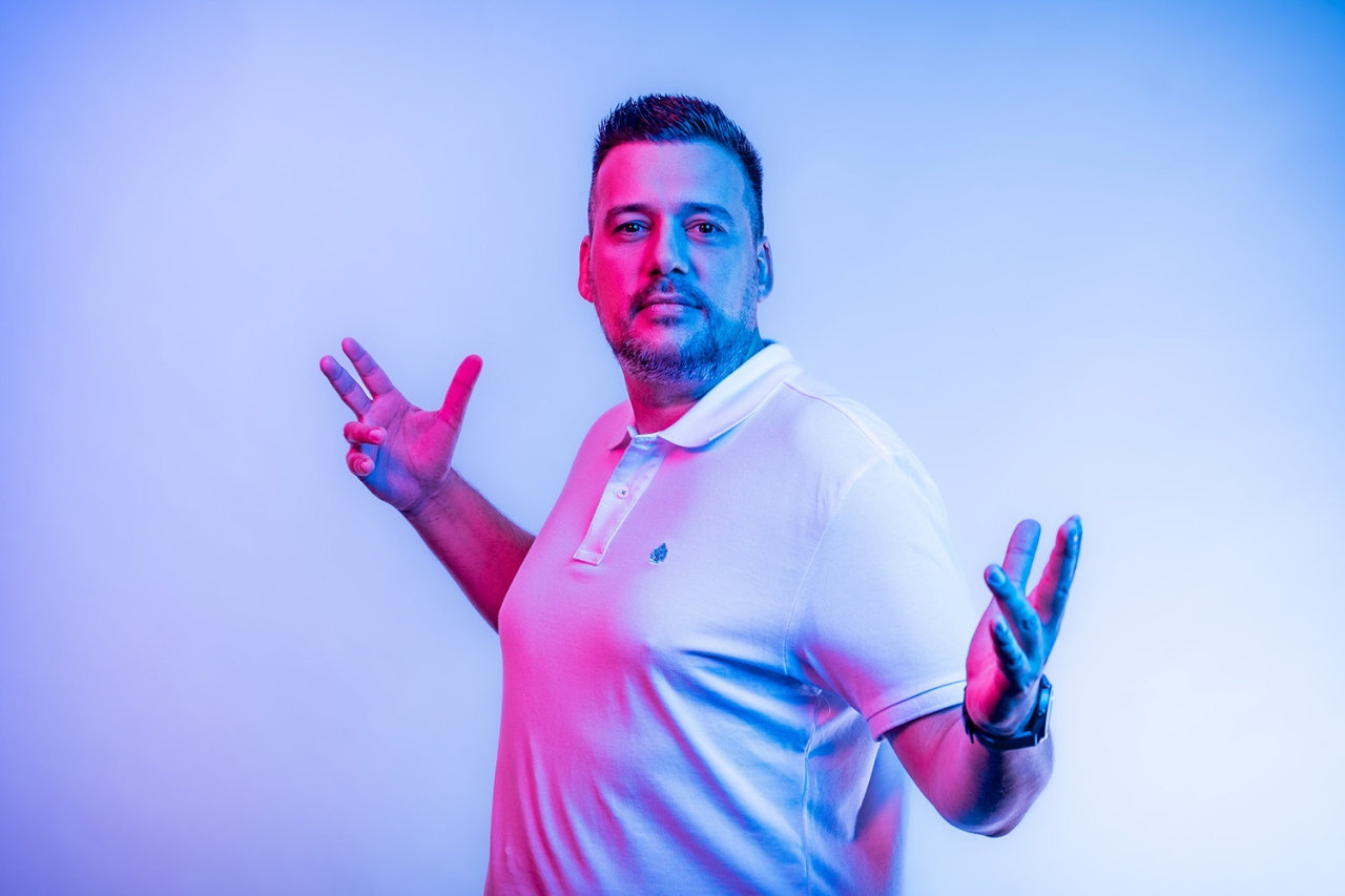 Man holds hands to the side